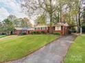 Ranch home with carport and large yard at 7101 Ridgebrook Dr, Charlotte, NC 28210