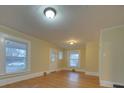 Living room with hardwood floors and large windows at 126 E Division Ave, Salisbury, NC 28144