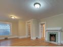Hardwood floors and a fireplace feature in this spacious living room at 126 E Division Ave, Salisbury, NC 28144