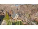 Aerial view of house with backyard and trees near lake at 5752 Natoma Rd, Lake Wylie, SC 29710