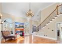 Living area with hardwood floors, fireplace, and large windows at 5752 Natoma Rd, Lake Wylie, SC 29710