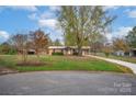Ranch home situated on a spacious lot with a long driveway at 130 Island Park Ln, Statesville, NC 28625