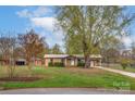 Ranch house with a large yard and driveway at 130 Island Park Ln, Statesville, NC 28625