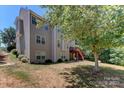 The property has a private backyard with mature trees and a deck at 3848 Burnage Hall Rd, Harrisburg, NC 28075