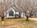 Charming home exterior showcasing well-maintained landscaping and attractive architectural details at 10519 Brawley Ln, Charlotte, NC 28215