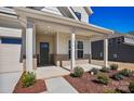 Inviting covered front porch with brick accents, offering a cozy entrance to the home at 1074 Kinship Dr # 110, Lancaster, SC 29720