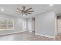 Bright living area features sleek floors, recessed lights, and white trim, offering views of the landscaped outdoors at 3007 Buffett Ln, Monroe, NC 28110