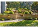 Landscaped retaining walls with stairs and pathway lighting at 3853 Gordon St, Terrell, NC 28682