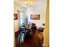 Bright dining room featuring dark wood floors and a stylish light fixture, great for Gathering gatherings at 13112 Appolinaire Dr, Davidson, NC 28036