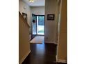 Inviting foyer with hardwood floors, showcasing a glimpse of the bright, airy interior at 13112 Appolinaire Dr, Davidson, NC 28036
