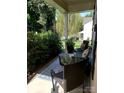 Cozy porch with comfortable seating, perfect for relaxing and enjoying the outdoor view of the surrounding greenery at 13112 Appolinaire Dr, Davidson, NC 28036