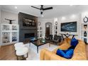 Spacious living room featuring a modern fireplace and stylish furnishings at 15126 Sustar Farm Dr # 36, Matthews, NC 28105