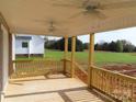Spacious back porch with ceiling fans and views of the backyard at 311 Genell Ln # 29, Rock Hill, SC 29730