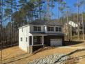 Two-story home with brick and white siding, a large garage, and a front porch at 403 Imperial Way # 24, Albemarle, NC 28001