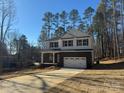 Two-story home with brick and white siding, a large garage, and a front porch at 403 Imperial Way # 24, Albemarle, NC 28001