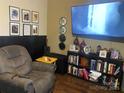 Relaxing living room featuring a comfortable recliner, media center, and wall decorations, creating a cozy space at 941 10Th St # 3, Lancaster, SC 29720