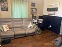 Inviting living room with comfortable seating, a desk, and motivational wall decor, creating a cozy and inspiring space at 941 10Th St # 3, Lancaster, SC 29720