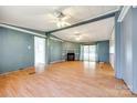 Spacious living room with fireplace, ceiling fans and sliding doors leading to the yard at 5320 Liberty Hill W Rd, York, SC 29745