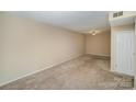 Spacious carpeted bedroom with ceiling fan and closet at 7141 Stonington Ln, Charlotte, NC 28227