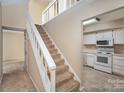 Open entryway with view of kitchen and staircase at 7141 Stonington Ln, Charlotte, NC 28227