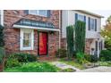 Brick front exterior with red door and well-maintained landscaping at 2705 North Center St # 74, Hickory, NC 28601