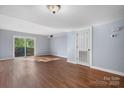 Spacious living area featuring hardwood floors and a sliding glass door at 2705 North Center St # 74, Hickory, NC 28601