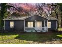 Gray house with white trim and a front porch at 2403 Mary Ave, Gastonia, NC 28052