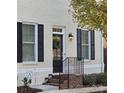 Front entrance with black shutters, brick steps and a wreath at 548 Summerfield Pl, Belmont, NC 28012