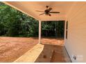 Covered back porch with ceiling fan, overlooking spacious backyard at 9130 Dulwich Dr # Ken0079, Charlotte, NC 28215