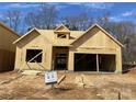 New construction home framing, showcasing a two-car garage at 9130 Dulwich Dr # Ken0079, Charlotte, NC 28215