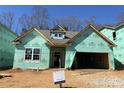 New construction home with Kingspan GreenGuard wrap and visible framing, awaiting finishing touches in a vibrant community at 9130 Dulwich Dr # Ken0079, Charlotte, NC 28215