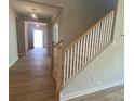 Beautiful staircase with wood treads and white risers, leading to the upper level of the home at 9130 Dulwich Dr # Ken0079, Charlotte, NC 28215