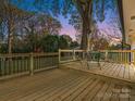 Spacious deck with seating area, overlooking backyard at 201 Seneca Pl, Charlotte, NC 28210