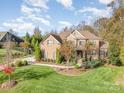 Two story home with landscaped yard and basketball court at 3014 Highbury Pl, Weddington, NC 28104