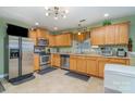 Spacious kitchen with wood cabinets, stainless steel appliances, and granite countertops at 7546 Lady Liberty Ln, Charlotte, NC 28217