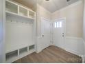 Bright entryway with built-in bench seating and storage at 2033 White Cypress Ct # Kh06, Charlotte, NC 28216