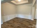 Bright dining room with wainscoting and hardwood floors at 401 Imperial Way # 25, Albemarle, NC 28001