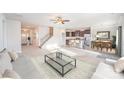 Spacious living room with open floor plan flowing into a modern kitchen and dining area at 159 Rubys Way # 35, Oakboro, NC 28129