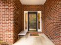 Front entrance with brick facade and glass door at 1801 Brandywine Dr, Matthews, NC 28105