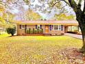 Inviting single-story brick home featuring a covered entrance and well-maintained lawn at 1905 26Th Ne St, Hickory, NC 28681