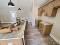 Modern kitchen with light brown cabinets and granite countertops at 3537 Taxahaw Rd, Lancaster, SC 29720