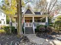 Quaint craftsman home, featuring a front porch and manicured landscaping at 716 Ellsworth Rd, Charlotte, NC 28211