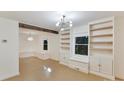 Bright living room with built-in shelving and hardwood floors at 716 Ellsworth Rd, Charlotte, NC 28211