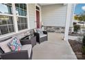 Relaxing front porch with wicker chairs and pillows at 1356 Augustus Beamon Dr, Indian Trail, NC 28079