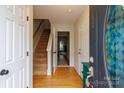 Entryway with hardwood floors and staircase at 140 Rock Ridge Ln, Mount Holly, NC 28120