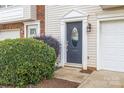 Townhome front door with landscaping at 140 Rock Ridge Ln, Mount Holly, NC 28120