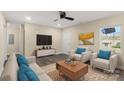 Bright living room with hardwood floors, comfy seating, and a modern coffee table at 2409 Crescent Ln, Gastonia, NC 28052