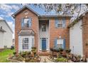 Brick home with blue shutters and a landscaped front yard at 4813 Chesney Nw St, Concord, NC 28027