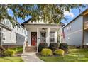 Cozy two-story home with a welcoming front porch, decorative wreath, and beautiful landscaping at 511 E Main St, Rock Hill, SC 29730