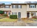 Attractive tan two-story townhouse exterior at 6102 Heath Ridge Ct # G, Charlotte, NC 28210